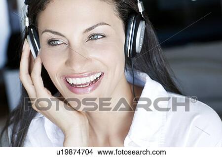 Listening to music View Large Photo Image Picture - Listening to music. Fotosearch