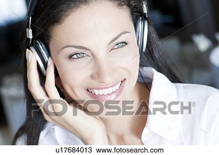 Listening to music View Large Photo Image Stock Image - Listening to music. Fotosearch