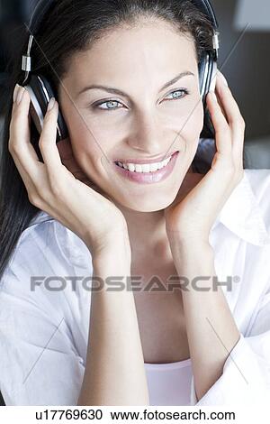 Listening to music View Large Photo Image Stock Image - Listening to music. Fotosearch