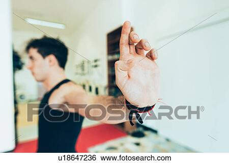 Stock Photograph - Man hands raised in martial art stance. Fotosearch