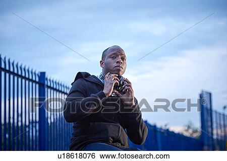Stock Photograph - Man with headphones looking at camera. Fotosearch