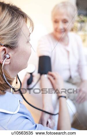Measuring blood pressure View Large Photo Image Stock Photography - Measuring blood pressure. Fotosearch