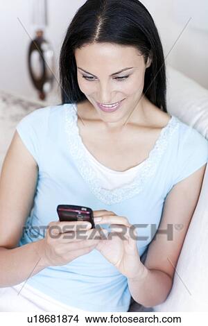 Picture - Mobile phone use. Fotosearch