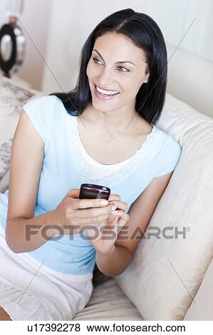 Stock Photo - Mobile phone use. Fotosearch
