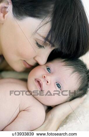 Stock Photo - Mother and baby girl. Fotosearch