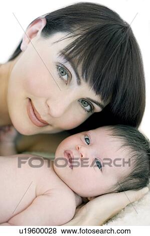 Stock Photo - Mother and baby girl. Fotosearch