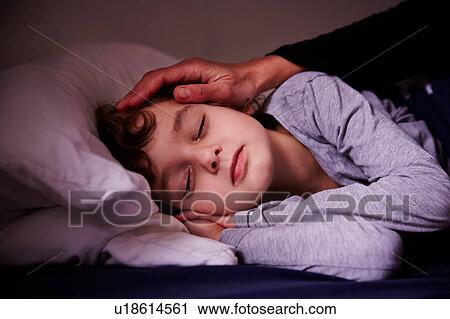 Mothers hand stroking sleeping boy View Large Photo Image Stock Image - Mothers hand stroking sleeping boy. Fotosearch