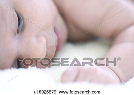 Newborn baby girl View Large Photo Image Stock Photo - Newborn baby girl. Fotosearch
