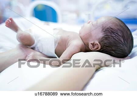 Nurse and premature baby View Large Photo Image Stock Photo - Nurse and premature baby. Fotosearch