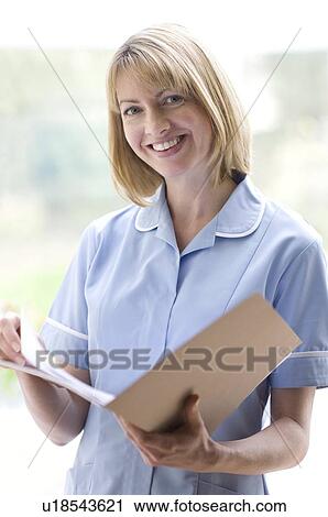Nurse checking notes View Large Photo Image Stock Image - Nurse checking notes. Fotosearch