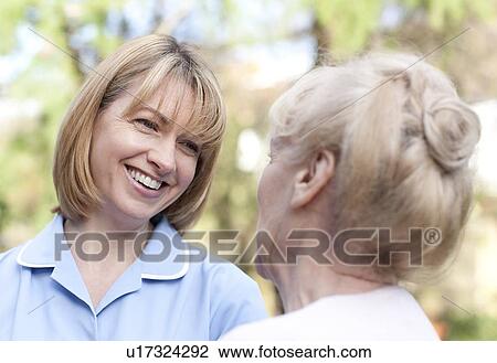 Nurse on a home visit View Large Photo Image Stock Image - Nurse on a home visit. Fotosearch