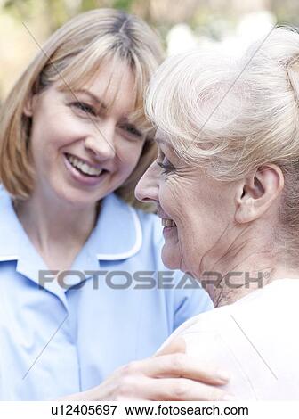 Stock Photo - Nurse on a home visit. Fotosearch