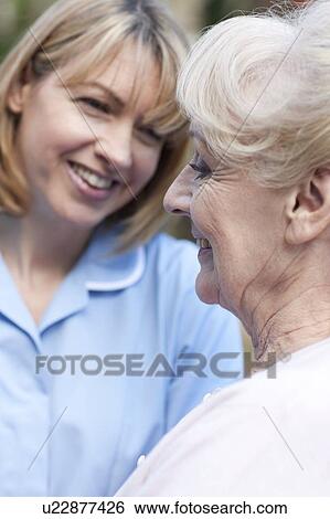 Nurse on a home visit View Large Photo Image Stock Photograph - Nurse on a home visit. Fotosearch