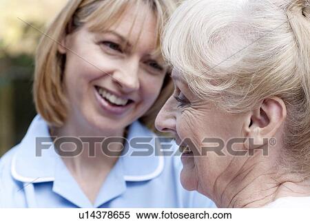 Stock Photography - Nurse on a home visit. Fotosearch