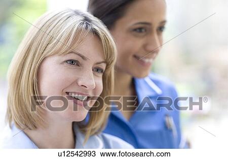 Stock Image - Nurses smiling. Fotosearch