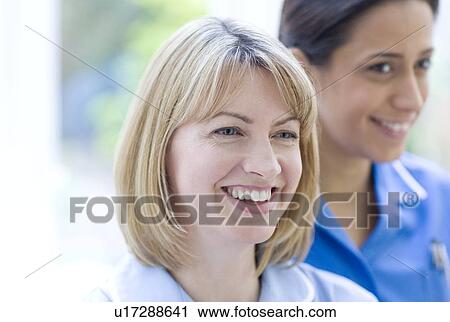 Stock Image - Nurses smiling. Fotosearch