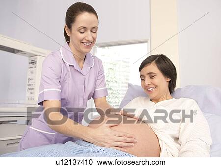 Stock Image - Obstetric examination. Fotosearch
