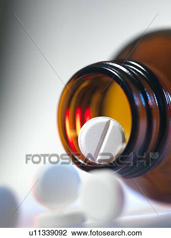 Pills spilling from a bottle View Large Photo Image Stock Image - Pills spilling from a bottle. Fotosearch