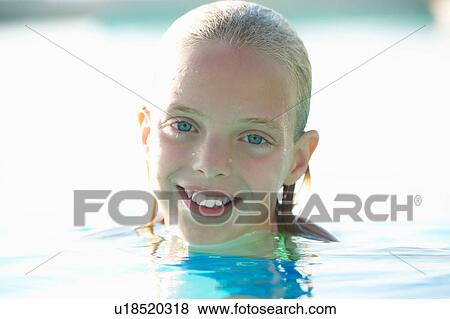 Portrait of blue eyed girl in swimming pool, Buonconvento, Tuscany, Italy View Large Photo Image Stock Photo - Portrait of blue eyed girl in swimming pool, Buonconvento, Tuscany, Italy. Fotosearch