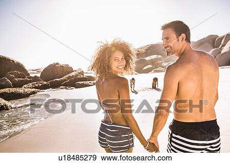 Portrait of couple and children on beach, Cape Town, South Africa View Large Photo Image Stock Photo - Portrait of couple and children on beach, Cape Town, South Africa. Fotosearch