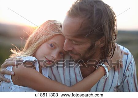 Portrait of girl hugging father, Buonconvento, Tuscany, Italy View Large Photo Image Stock Image - Portrait of girl hugging father, Buonconvento, Tuscany, Italy. Fotosearch