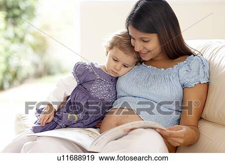 Pregnant woman and daughter View Large Photo Image Stock Photo - Pregnant woman and daughter. Fotosearch