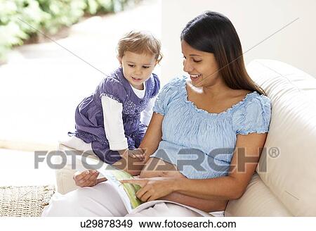 Stock Photo - Pregnant woman and daughter. Fotosearch