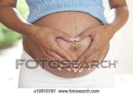 Pregnant woman's abdomen View Large Photo Image Stock Photo - Pregnant woman's abdomen. Fotosearch