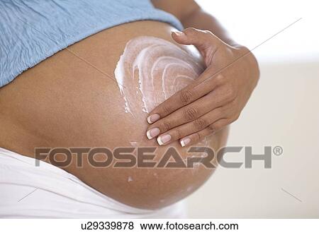 Pregnant woman's abdomen View Large Photo Image Stock Photo - Pregnant woman's abdomen. Fotosearch