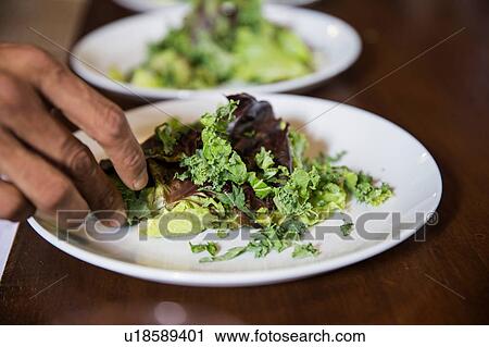 Restaurateur preparing salad View Large Photo Image Stock Image - Restaurateur preparing salad. Fotosearch