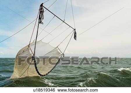 Seine fishing nets of fishing boat on ocean, Waddenzee, Friesland, Netherlands View Large Photo Image Stock Photograph - Seine fishing nets of fishing boat on ocean, Waddenzee, Friesland, Netherlands. Fotosearch