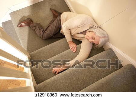 Stock Image - Senior woman injured in fall. Fotosearch
