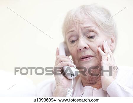 Picture - Senior woman talking on the telephone. Fotosearch