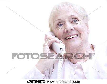 Senior woman talking on the telephone View Large Photo Image Stock Photo - Senior woman talking on the telephone. Fotosearch