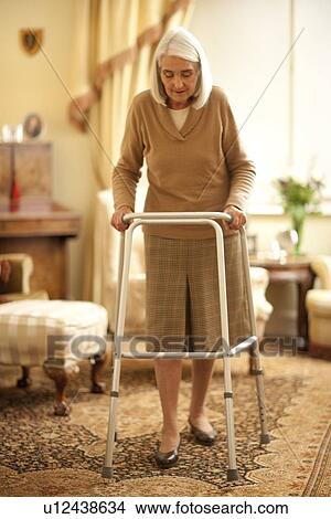 Senior woman with walking frame View Large Photo Image Picture - Senior woman with walking frame. Fotosearch