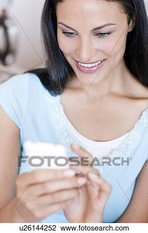 Stock Image - Smart phone use. Fotosearch