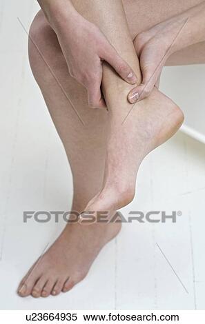 Stock Photography - Sore ankle. Fotosearch