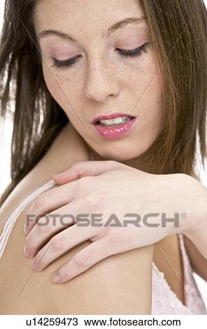 Stock Image - Sore shoulder. Fotosearch