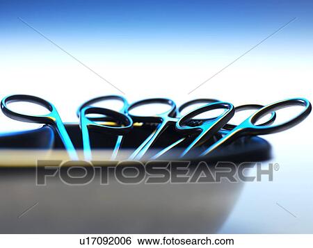 Surgical instruments in a dish View Large Photo Image Stock Photograph - Surgical instruments in a dish. Fotosearch
