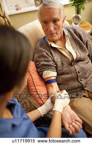 Stock Photography - Taking a blood sample. Fotosearch