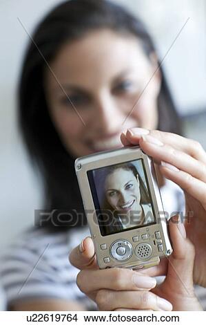 Picture - Taking a self portrait. Fotosearch