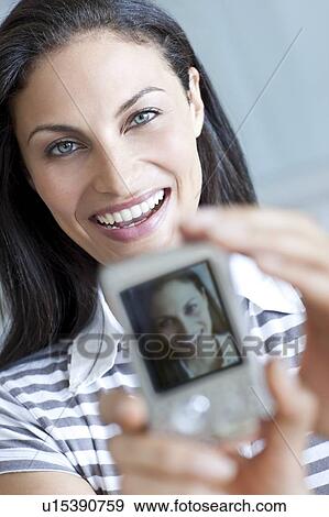 Taking a self portrait View Large Photo Image Stock Photo - Taking a self portrait. Fotosearch