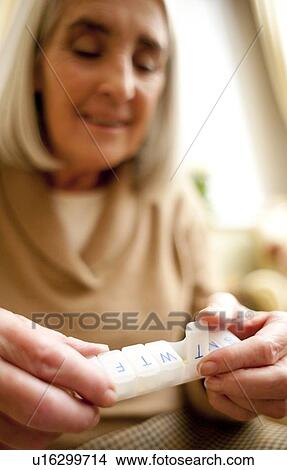 Taking medication View Large Photo Image Picture - Taking medication. Fotosearch