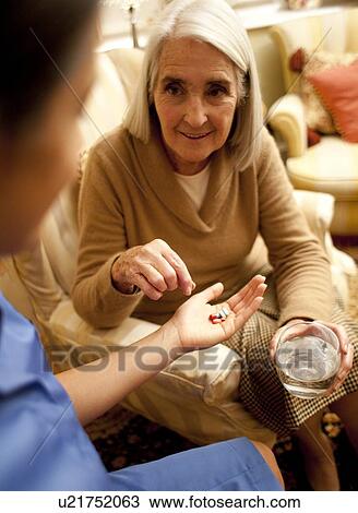 Taking medication View Large Photo Image Stock Image - Taking medication. Fotosearch