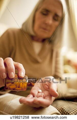 Stock Photo - Taking medication. Fotosearch