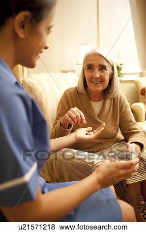 Taking medication View Large Photo Image Stock Photo - Taking medication. Fotosearch