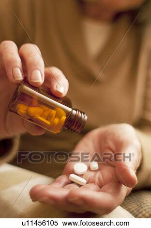 Stock Photography - Taking medication. Fotosearch