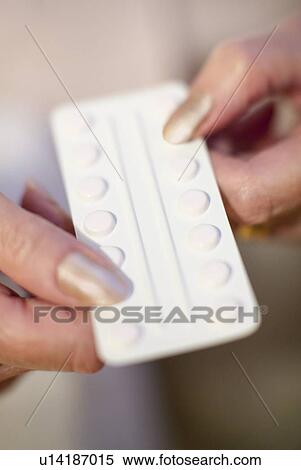 Stock Photography - Taking medication. Fotosearch