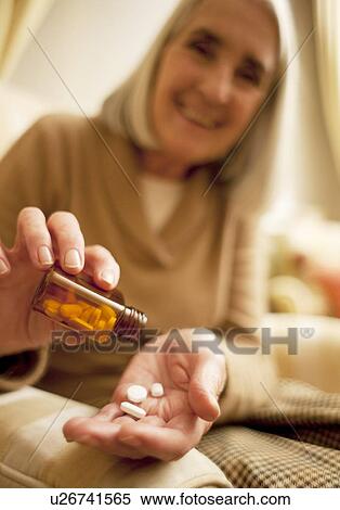 Taking medication View Large Photo Image Stock Photography - Taking medication. Fotosearch