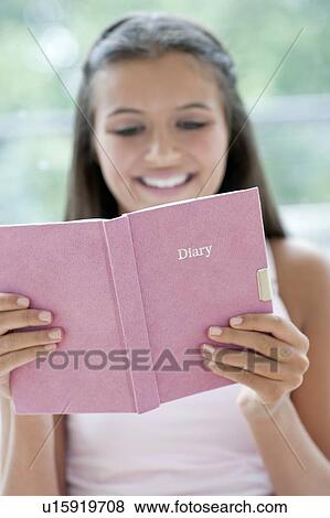 Stock Photo - Teenage girl and her diary. Fotosearch